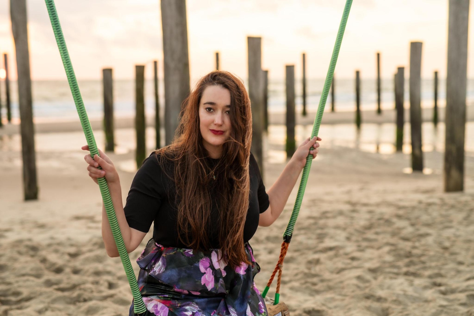 Heather Pinkham on a swing at the beach